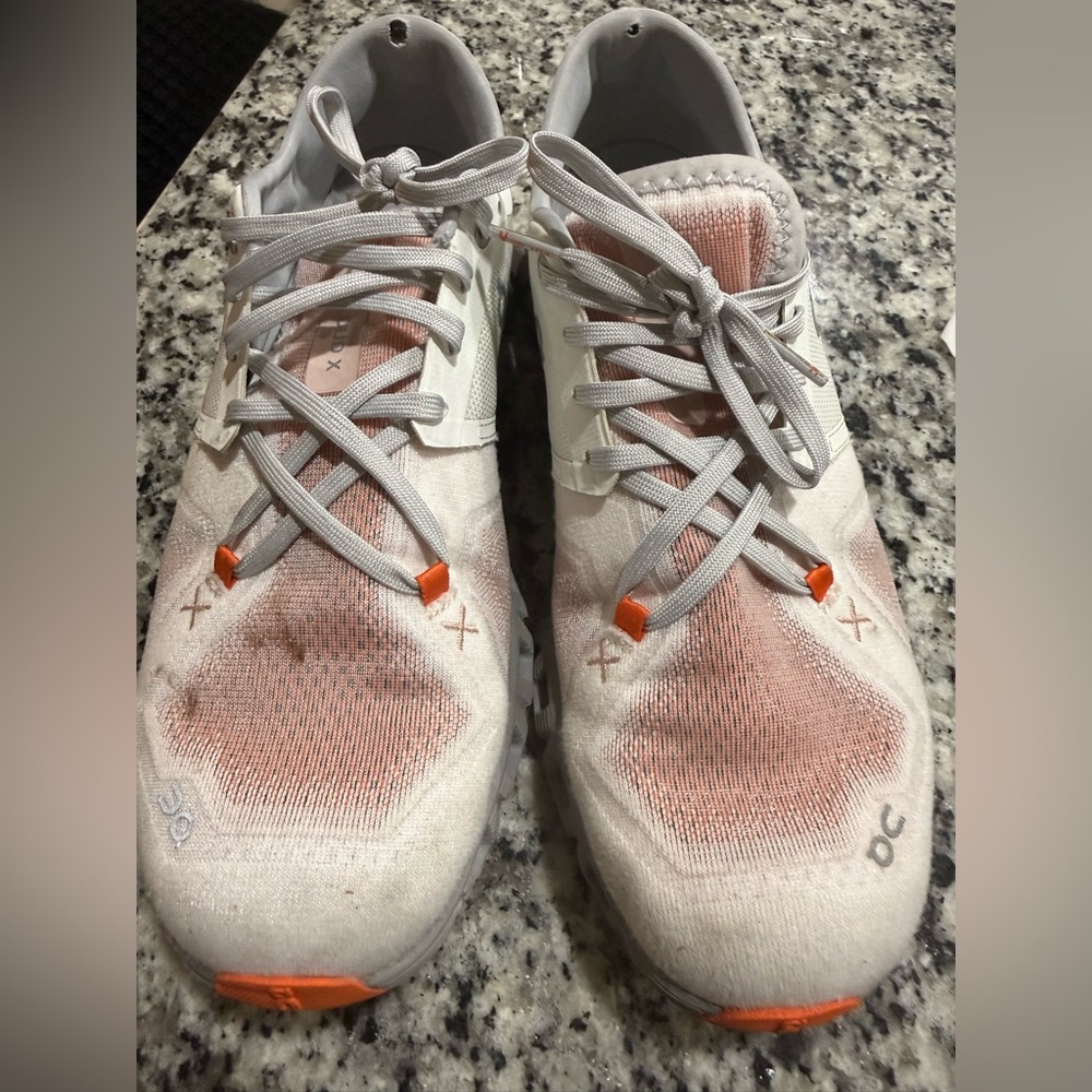 On Running White and Orange Sneakers